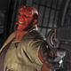 Hellboy aims his trusty gun, Good Samaritan, at an unseen foe in one of his Injustice 2 intro scenes.